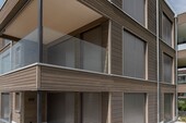 Wooden facade and balconies in the outdoor area