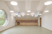 Spacious teachers' room in the attic with unique window architecture